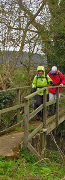 Pam & Bob on the footbridge over Nunburnholme Beck/ from a photo by Arnold Underwood, April 2008