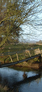 Ricketty footbridge over the River Rye! Not on our route /from a photo by Arnold Underwood/Dec 2004